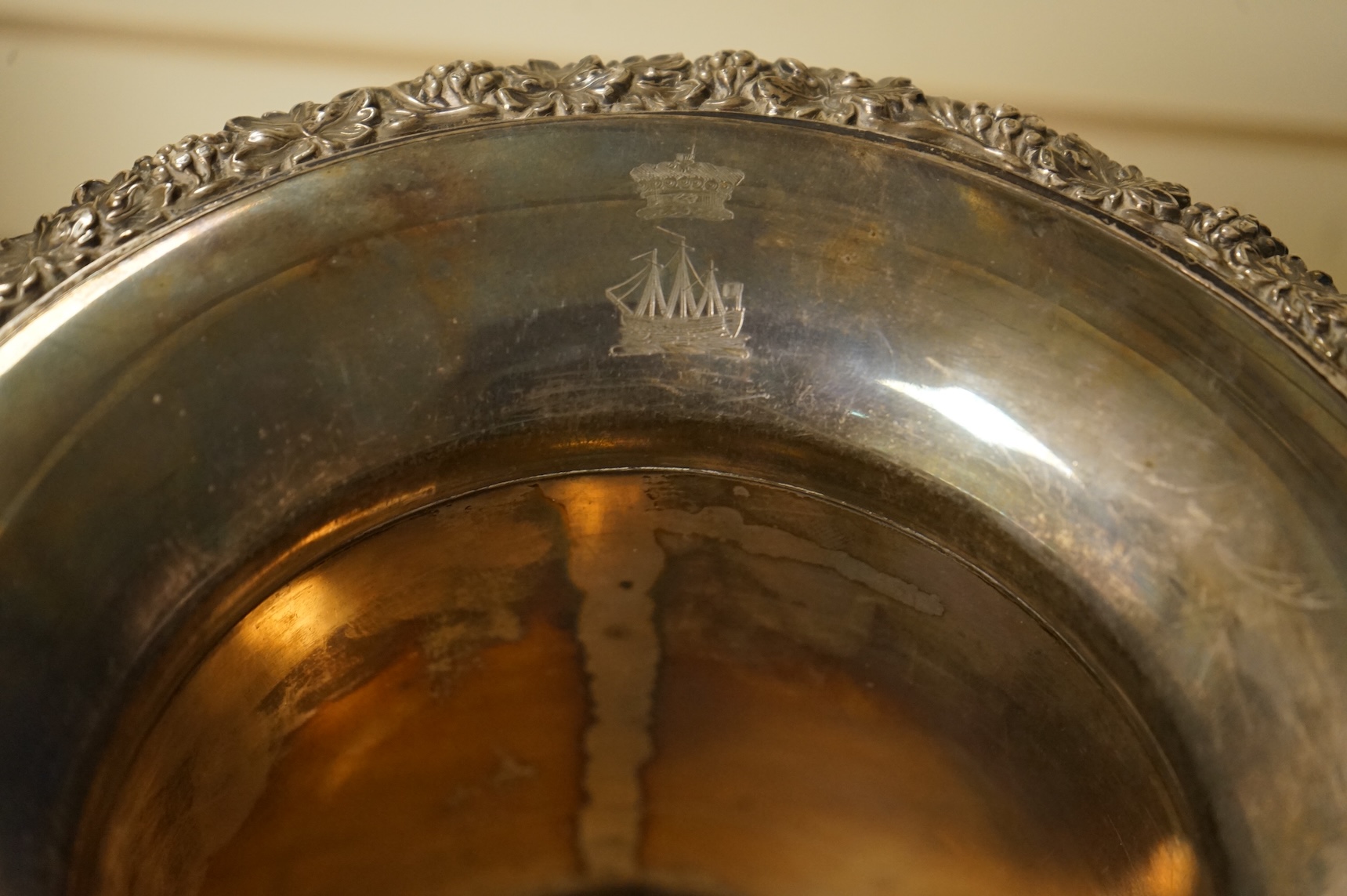 A Victorian silver plated campana wine cooler and removable liner, with vineous cast rim and bacchic mask twin handles, height 26cm.